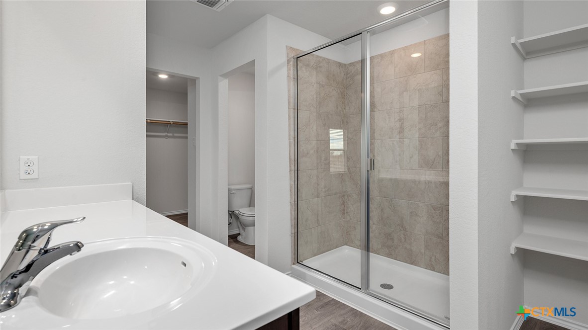 112 Little Green Trail Jarrell, TX 76537 - Photo 15 of 22 a bathroom with a shower and a sink