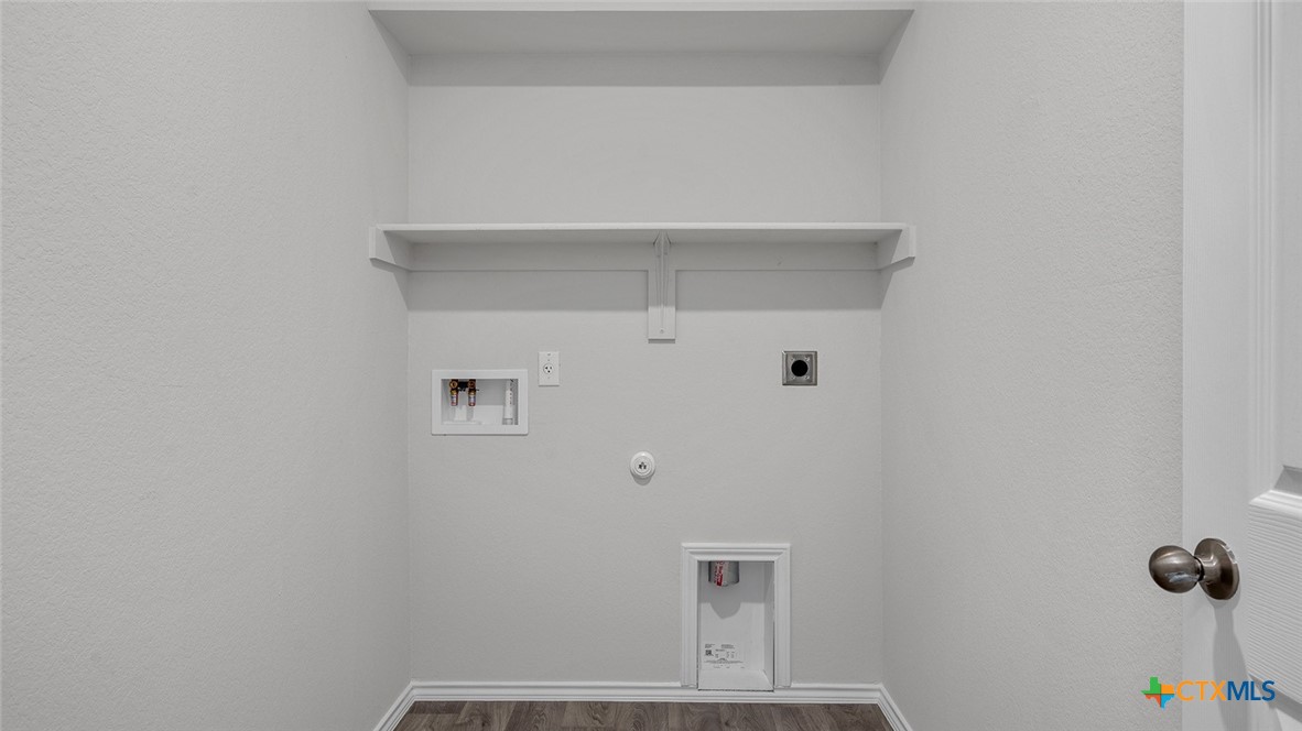 112 Little Green Trail Jarrell, TX 76537 - Photo 22 of 22 a view of small space with racks on the wall