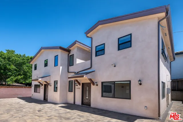 a front view of a house with a garage