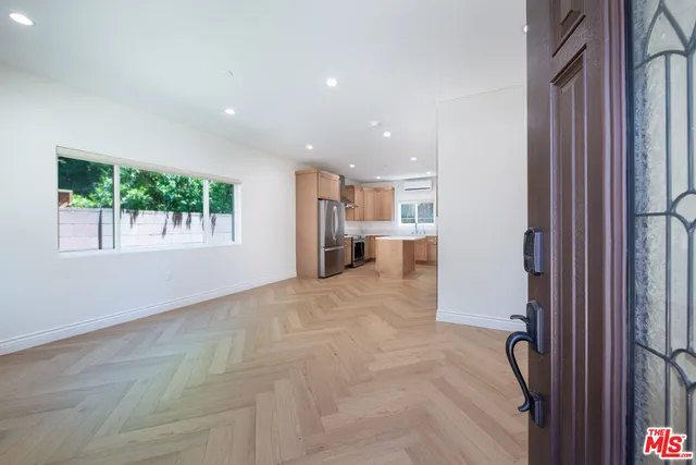a view of livingroom with furniture and windows