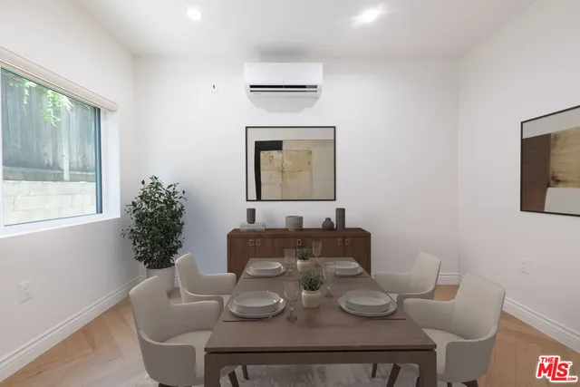 a dining room with furniture and wooden floor