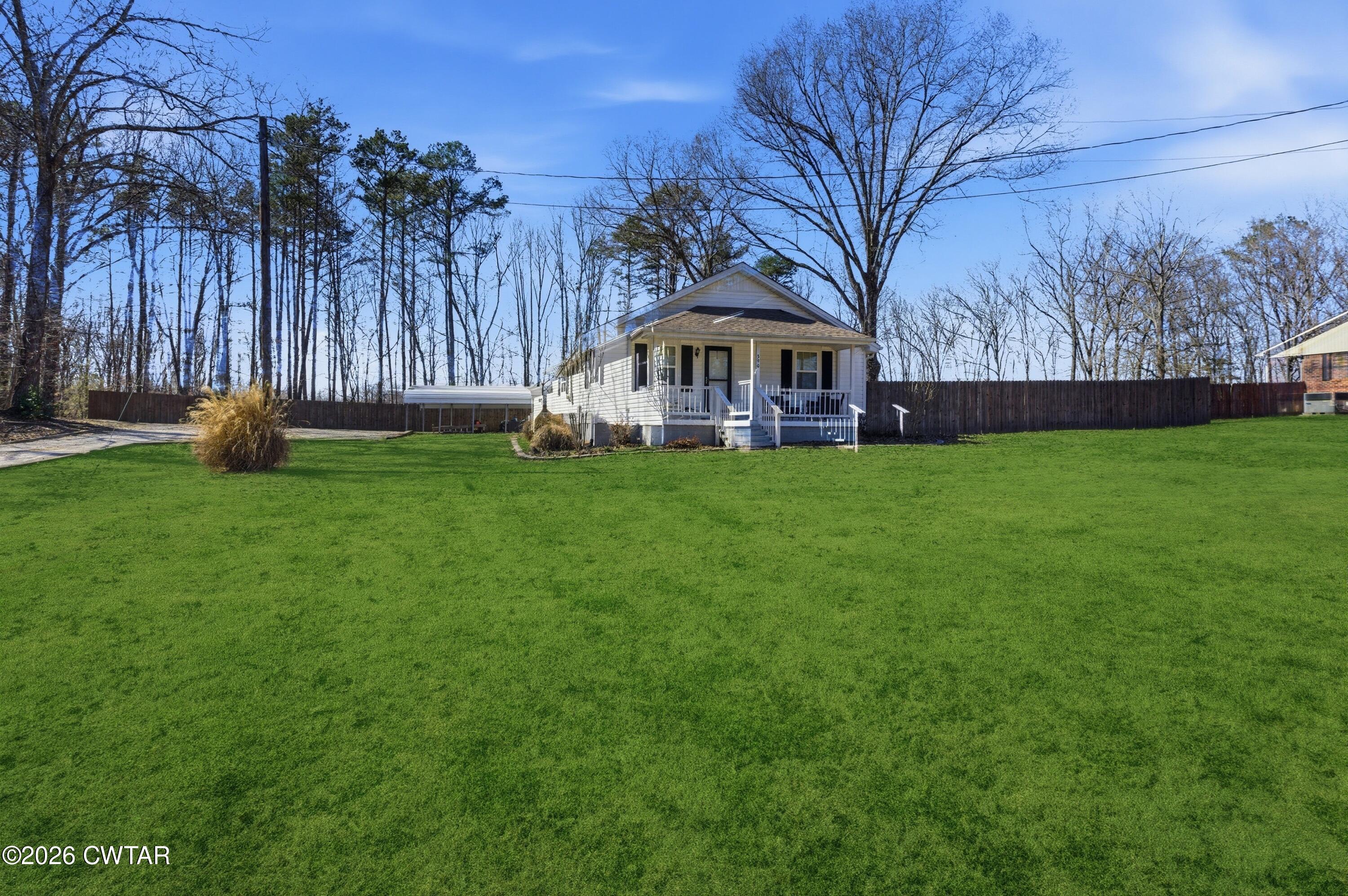 a view of a house with a big yard