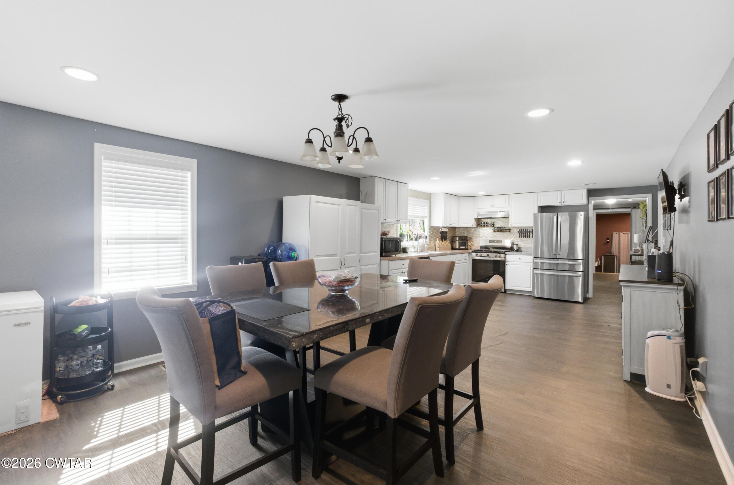 390 Memory Lane Henderson, TN 38340 - Photo 11 of 24 a view of a dining room with furniture and a window