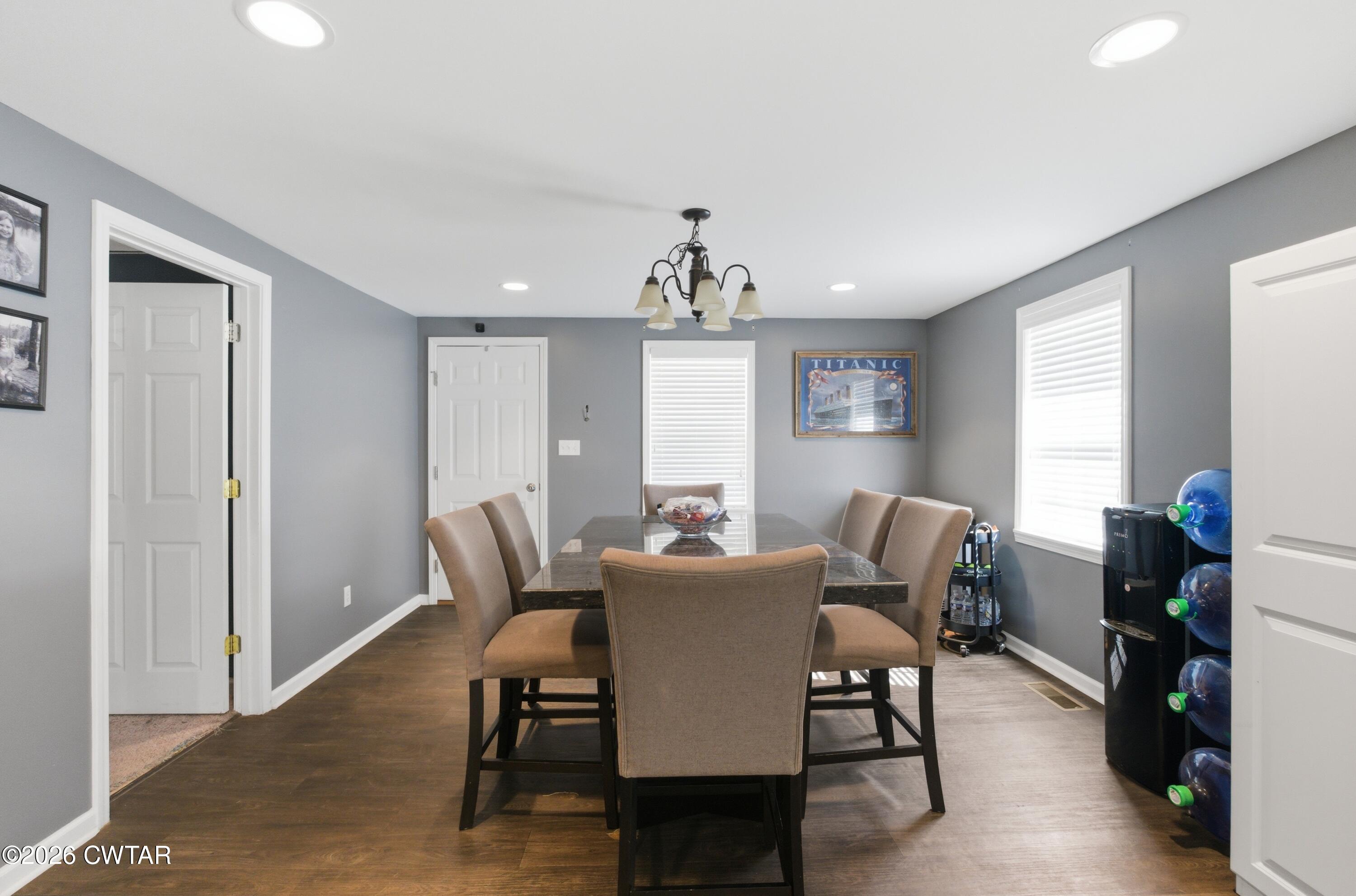 390 Memory Lane Henderson, TN 38340 - Photo 13 of 24 a view of a dining room with furniture window and wooden floor