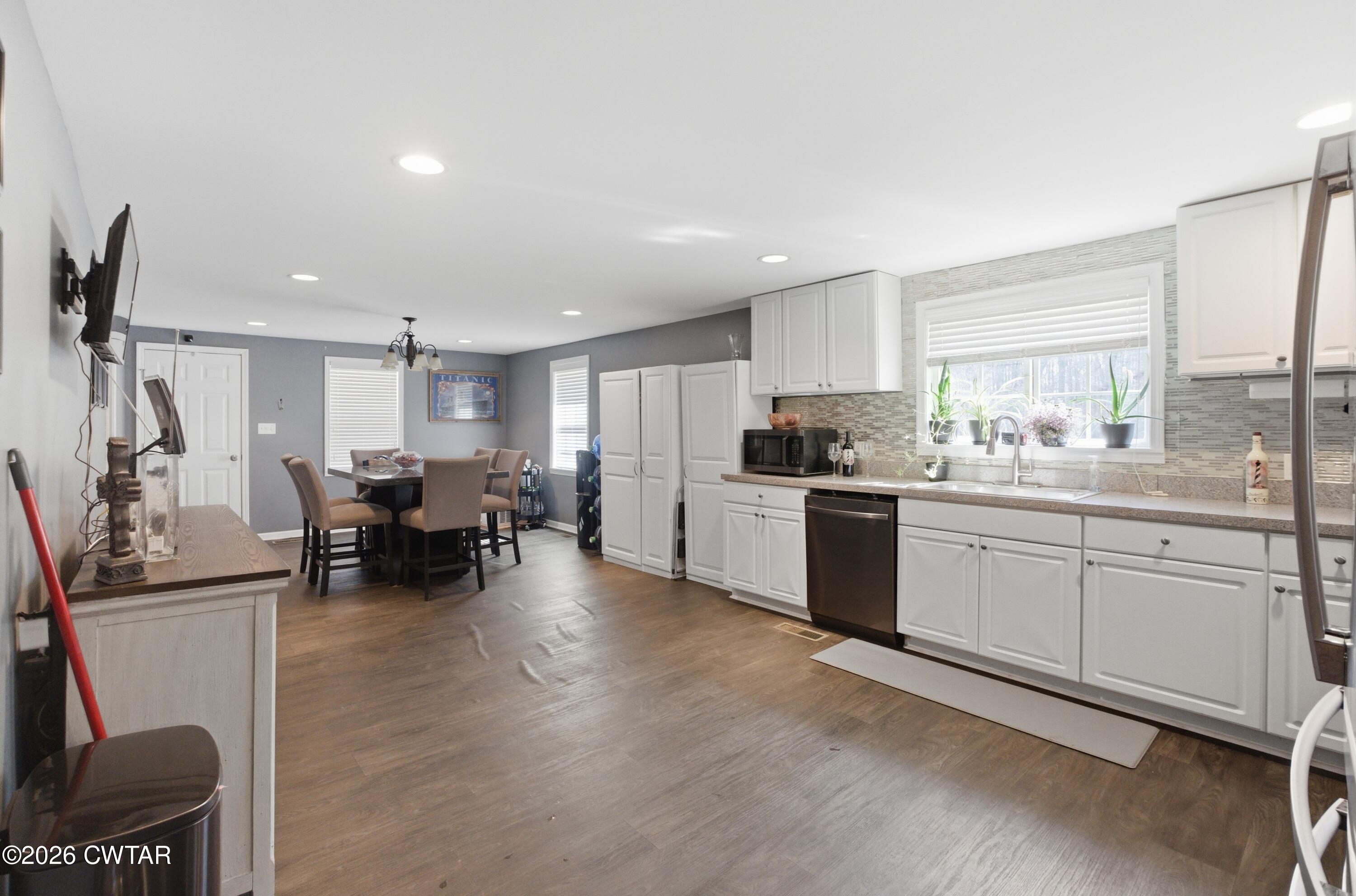 390 Memory Lane Henderson, TN 38340 - Photo 16 of 24 a kitchen with sink refrigerator and cabinets