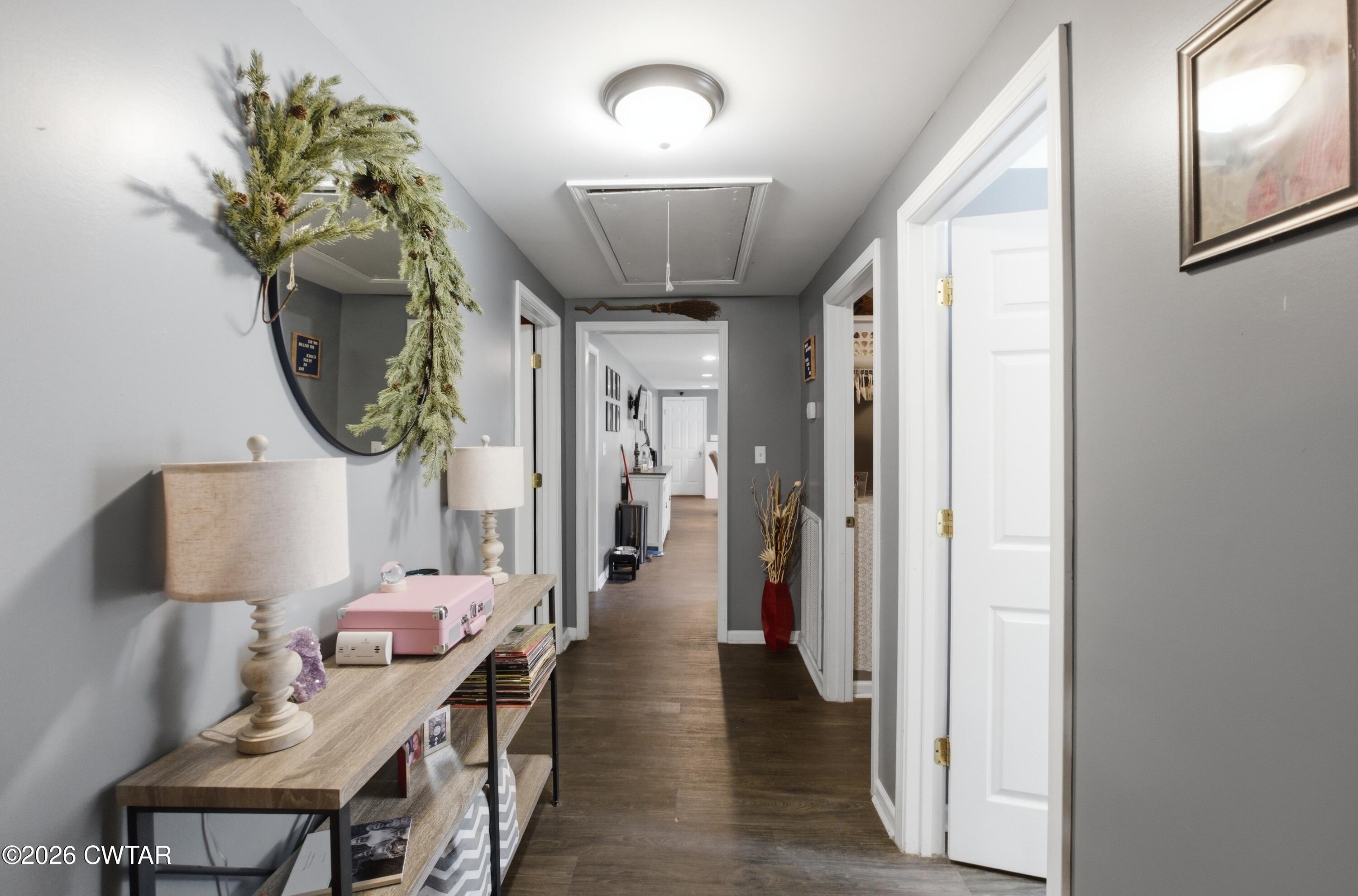 390 Memory Lane Henderson, TN 38340 - Photo 22 of 24 a view of a hallway with furniture and wooden floor