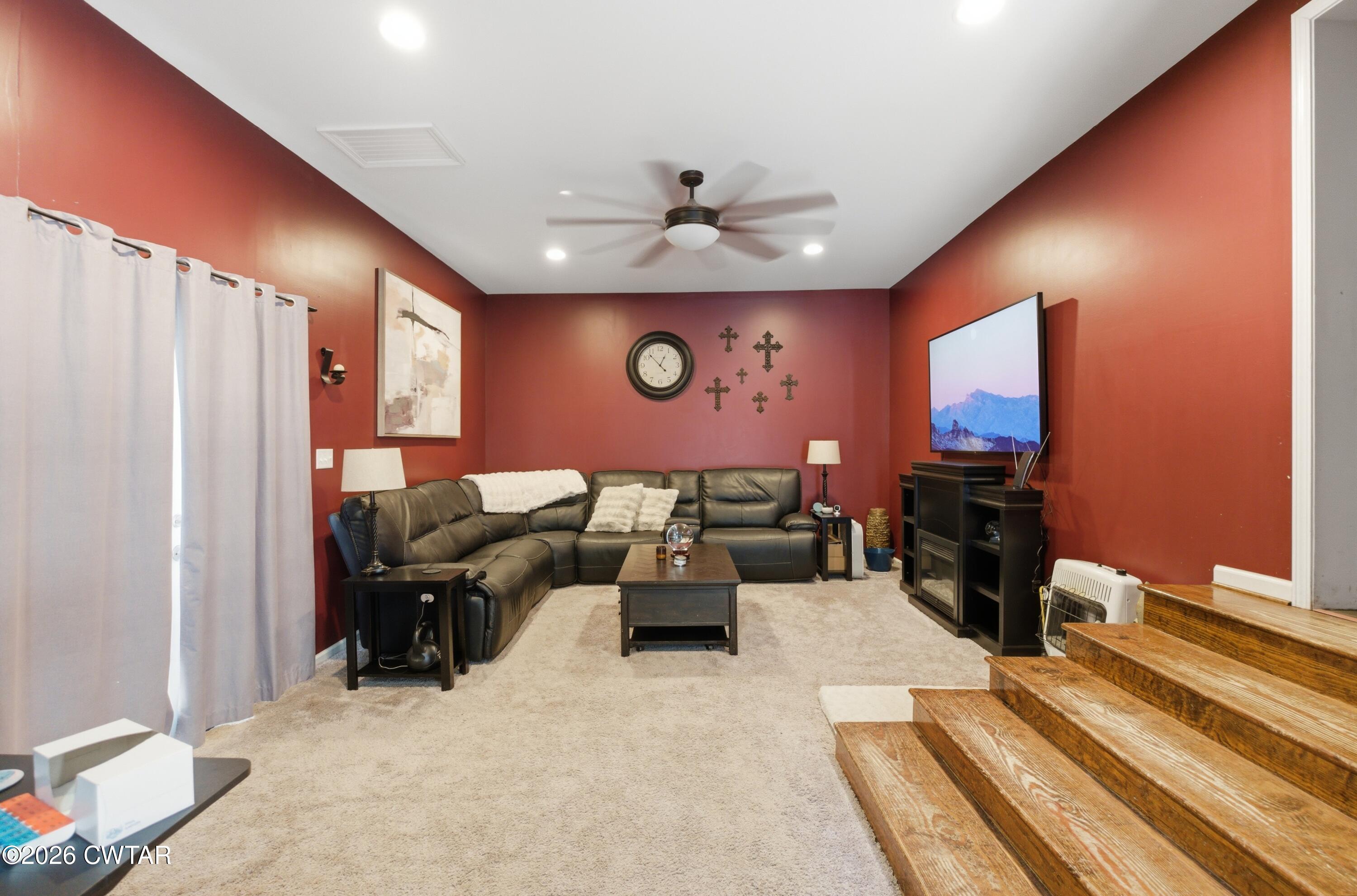390 Memory Lane Henderson, TN 38340 - Photo 23 of 24 a living room with furniture a flat screen tv and a couch