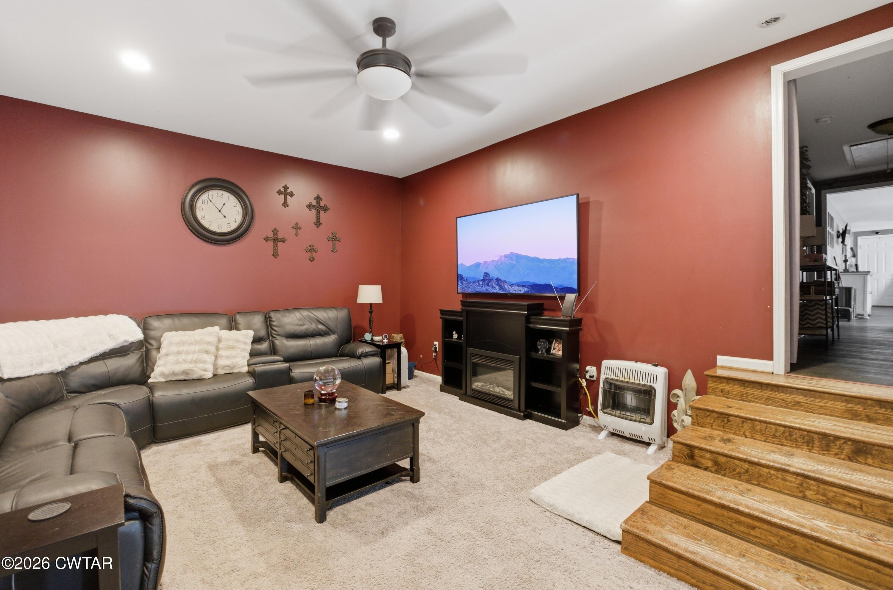 390 Memory Lane Henderson, TN 38340 - Photo 24 of 24 a living room with furniture and a flat screen tv