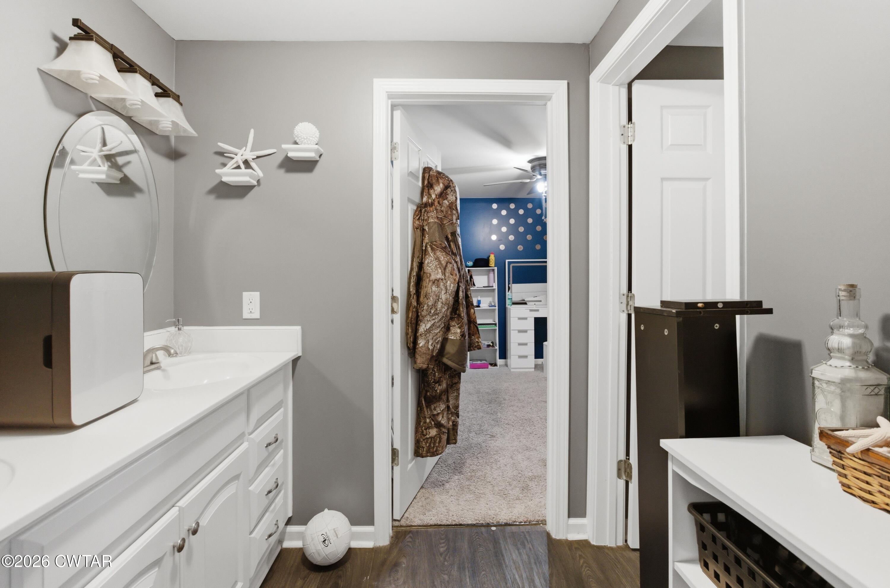 390 Memory Lane Henderson, TN 38340 - Photo 8 of 24 a bathroom with a sink vanity and a mirror