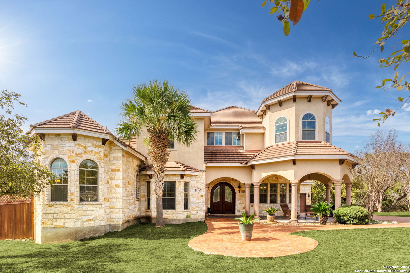 192 County Road 2812 Mico, TX 78056 - Photo 2 of 47 a front view of a house with a yard