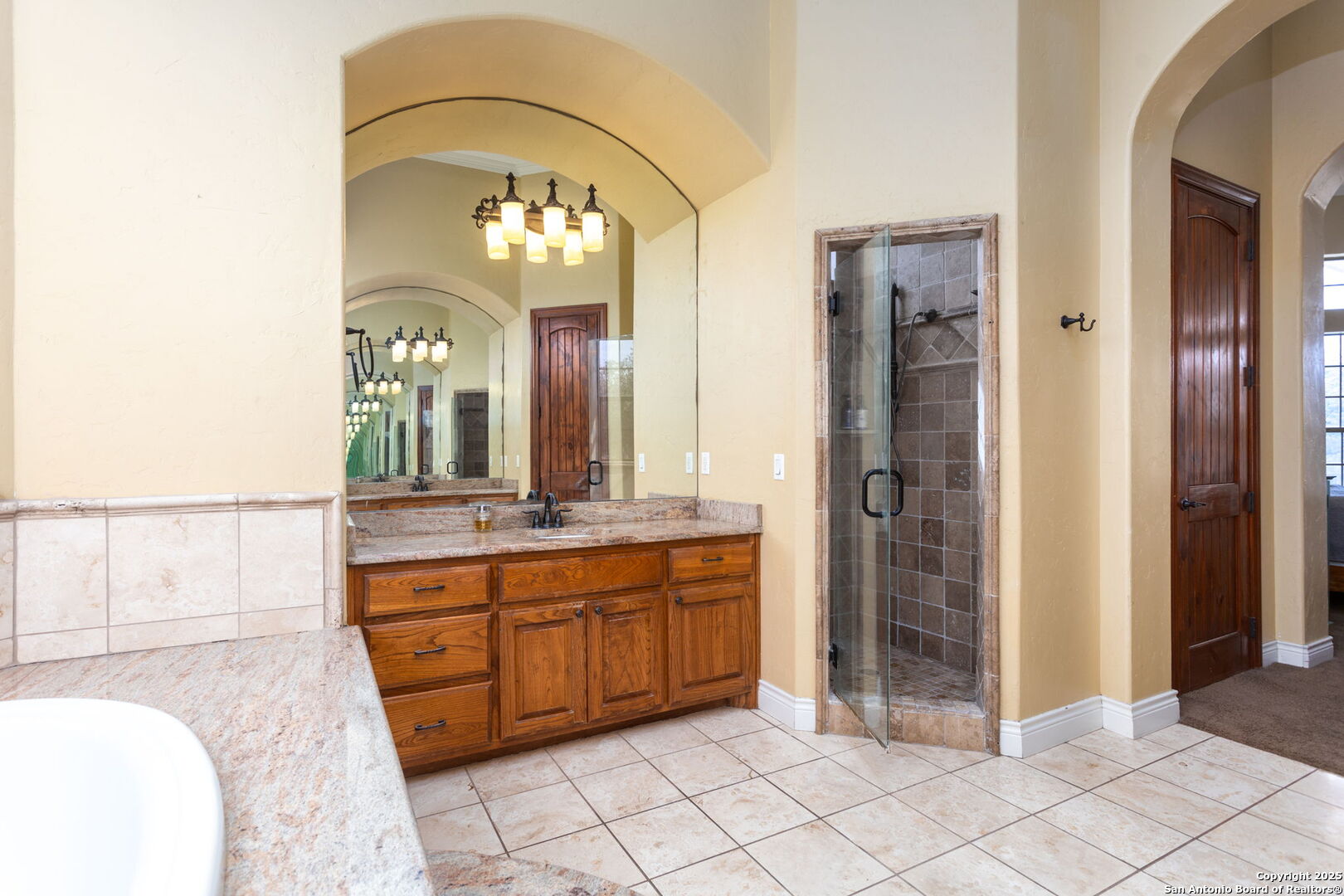 192 County Road 2812 Mico, TX 78056 - Photo 22 of 47 a bathroom with a double vanity sink and a mirror