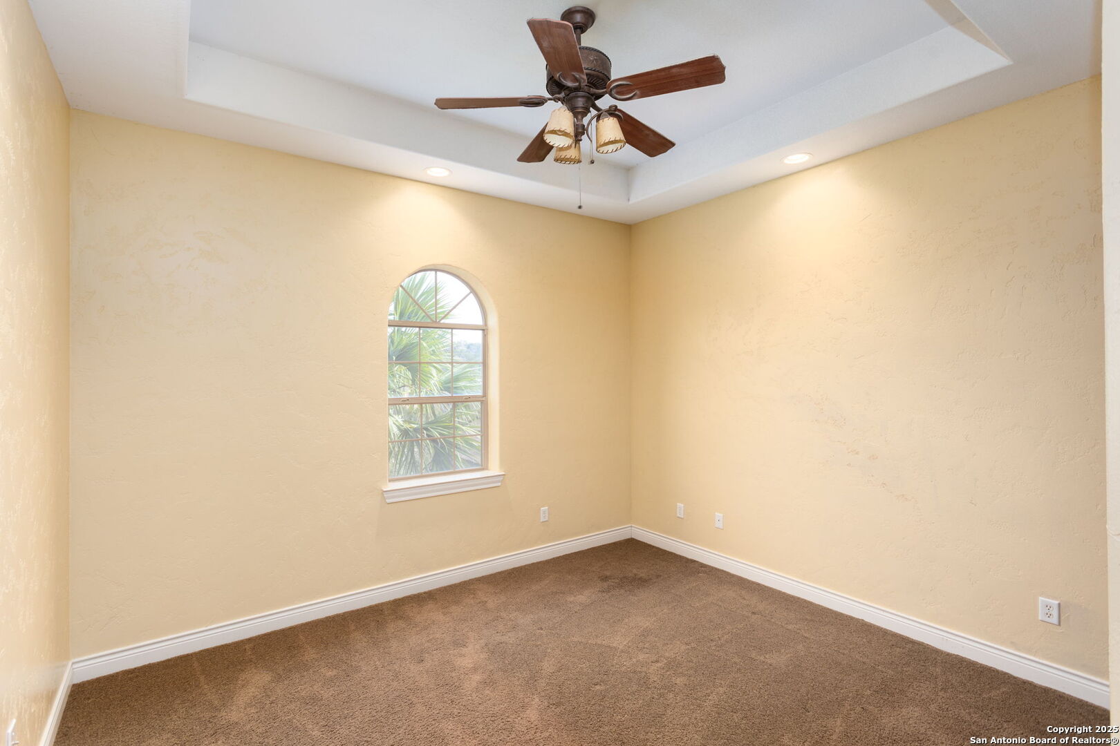 192 County Road 2812 Mico, TX 78056 - Photo 24 of 47 an empty room with a window and a fan