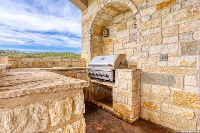 a view of a white house with a yard