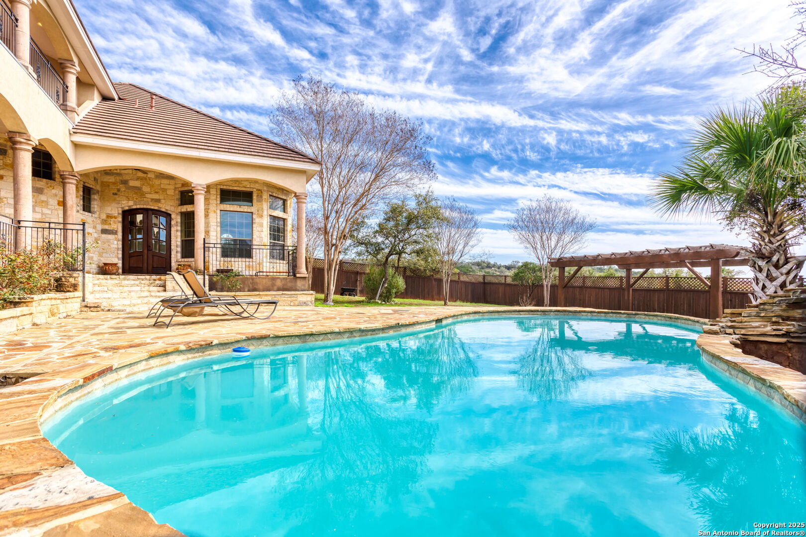 192 County Road 2812 Mico, TX 78056 - Photo 34 of 47 a swimming pool with outdoor seating and yard