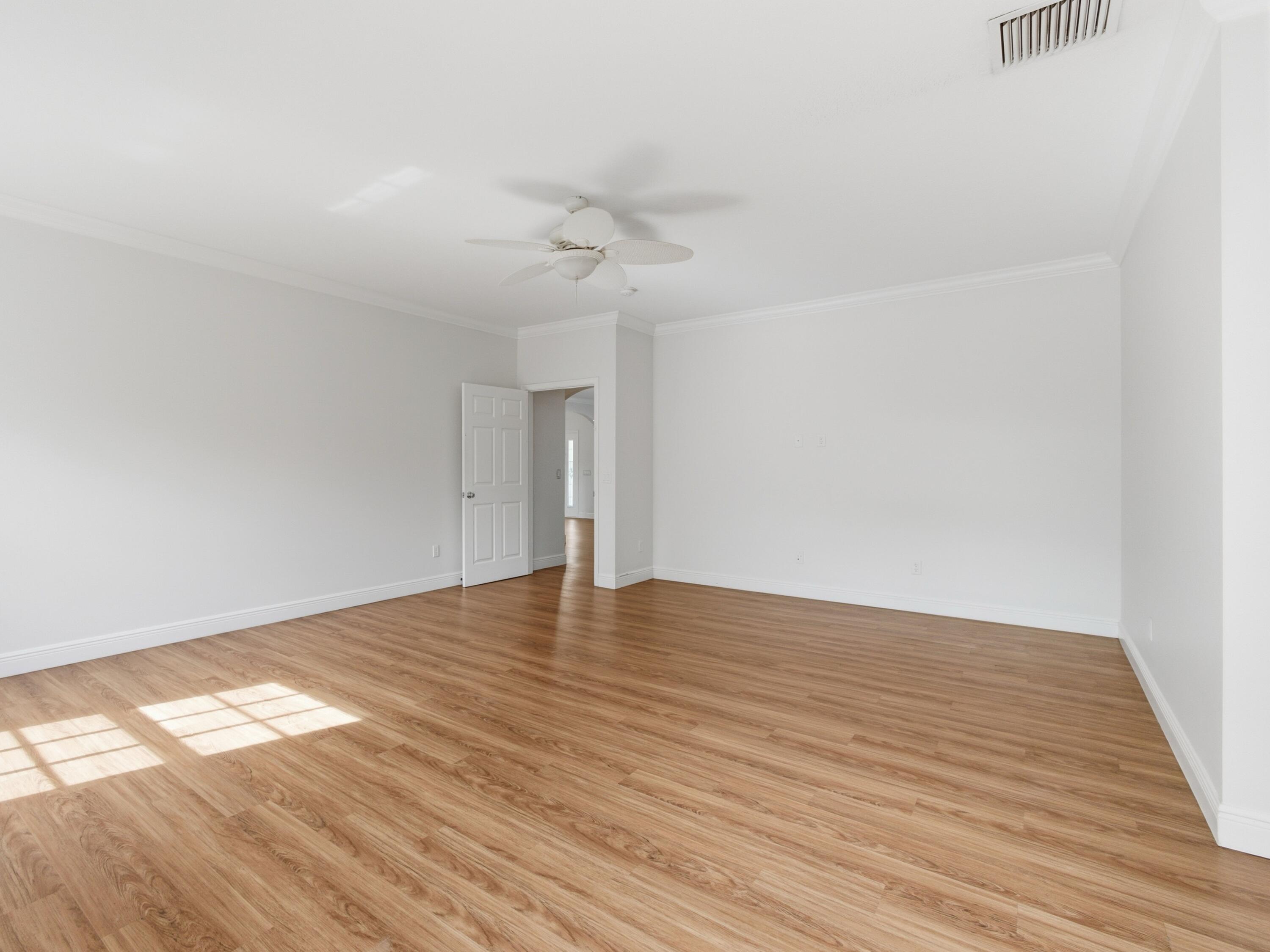 9322 Southeast Athena Street Hobe Sound, FL 33455 - Photo 33 of 68 wooden floor in an empty room