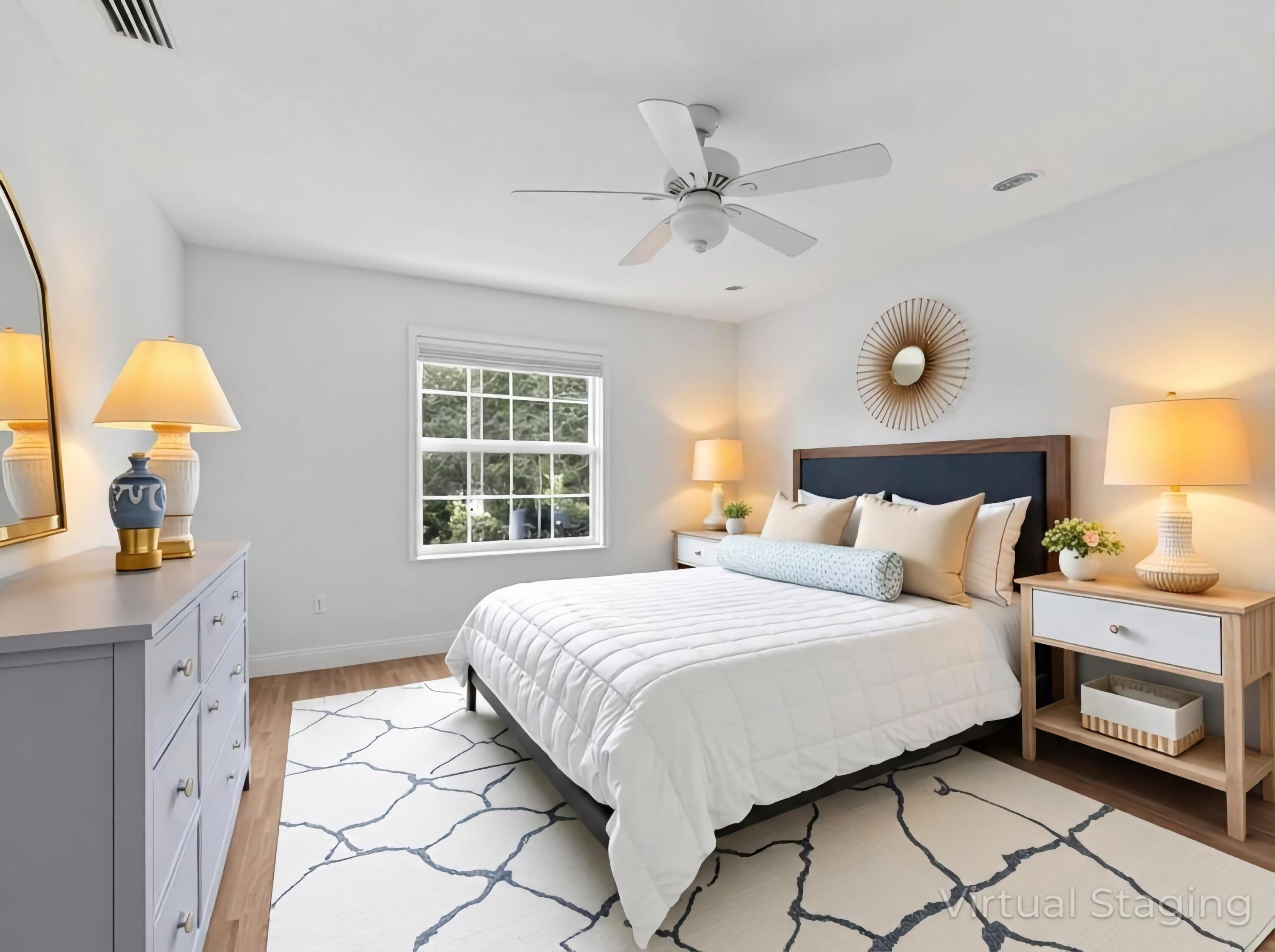 9322 Southeast Athena Street Hobe Sound, FL 33455 - Photo 41 of 68 a bedroom with a bed and a chandelier