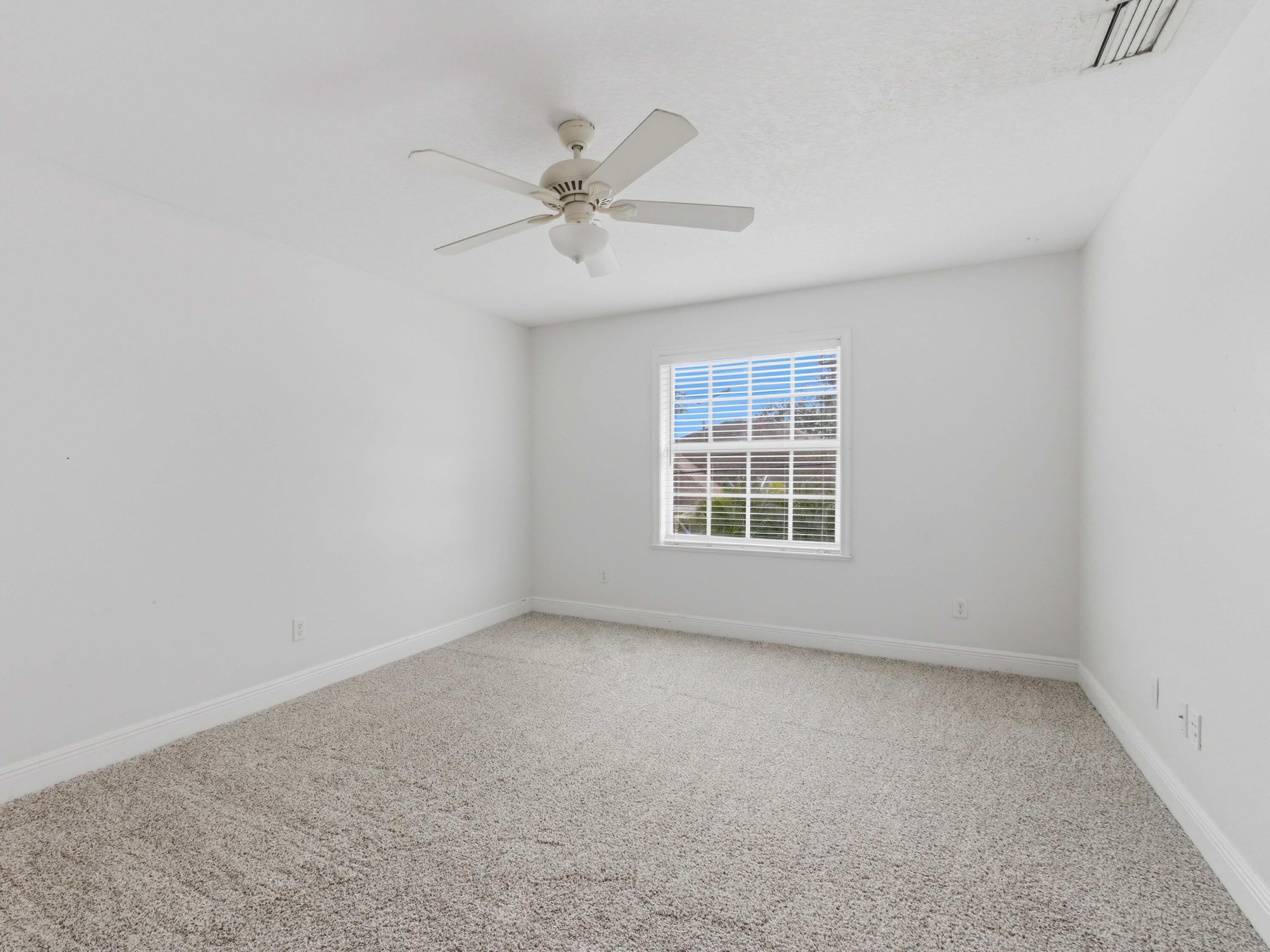 9322 Southeast Athena Street Hobe Sound, FL 33455 - Photo 43 of 68 an empty room with a window