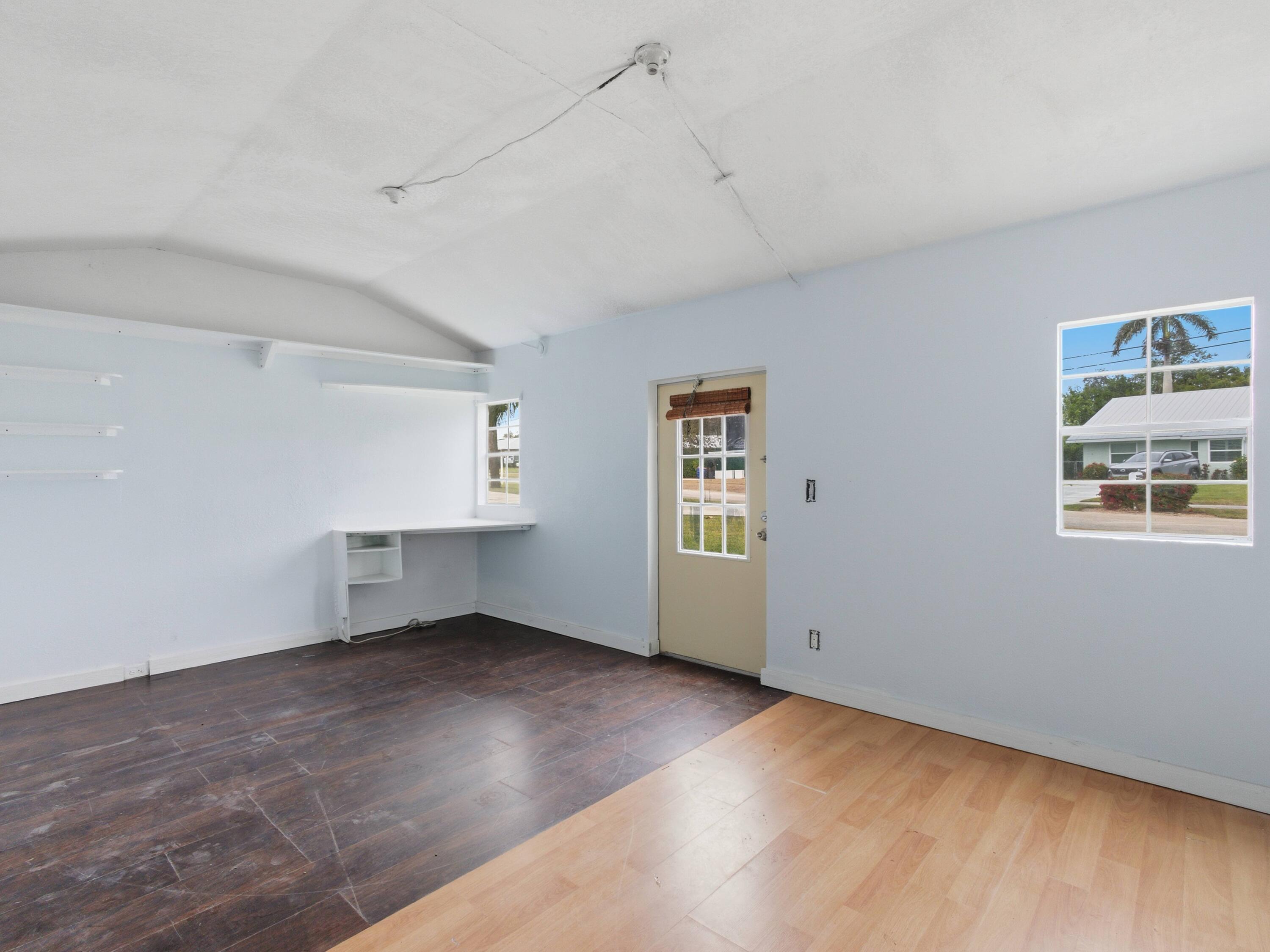 9322 Southeast Athena Street Hobe Sound, FL 33455 - Photo 62 of 68 an empty room with windows