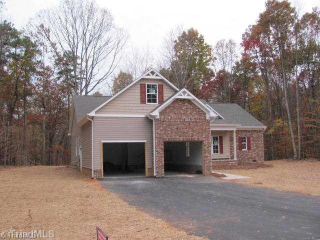1086 Tuttle Road Rural Hall, NC 27045 - Photo 10 of 11 Exterior Front. 2 CAR GARAGE SIDE ENTRANCE. PARTIAL BONUS ROOM OVER GARAGE.