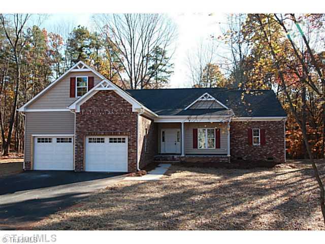 1086 Tuttle Road Rural Hall, NC 27045 - Photo 8 of 11 Exterior Front. Brick, Vinyl, 2 Car Garage. Partially finished Bonus Room over Garage.