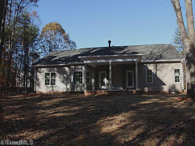 1086 Tuttle Road Rural Hall, NC 27045 - Photo 9 of 11 Exterior Back. Large Covered Back Porch with Ceiling Fan