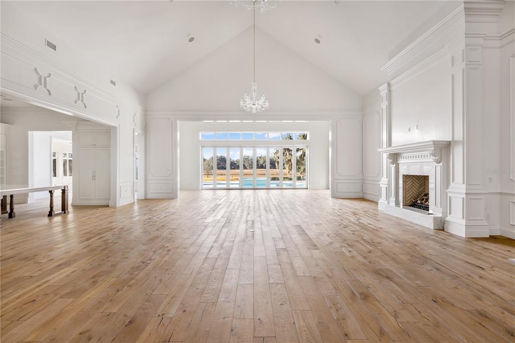 8570 Northwest 31st Lane Road Ocala, FL 34482 - Photo 11 of 53 a view of a livingroom with wooden floor a fireplace and window
