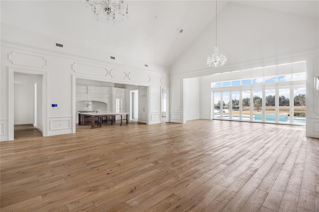 8570 Northwest 31st Lane Road Ocala, FL 34482 - Photo 16 of 53 an empty room with wooden floor and windows