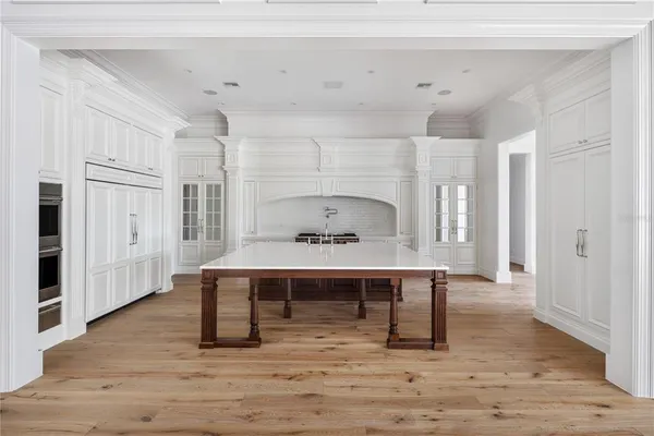 a view of a room with wooden floor and outdoor view