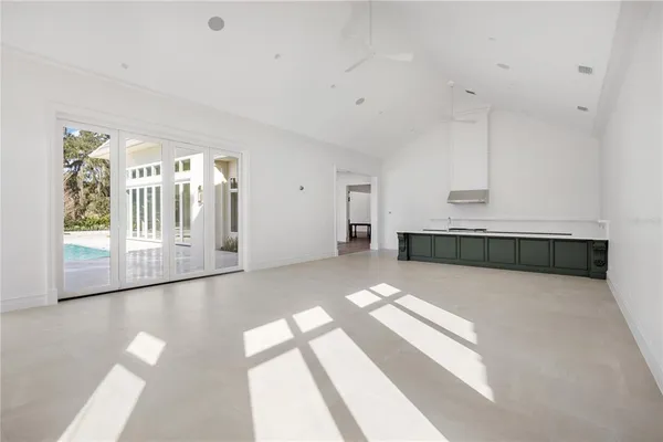 a view white cabinets and wooden floor