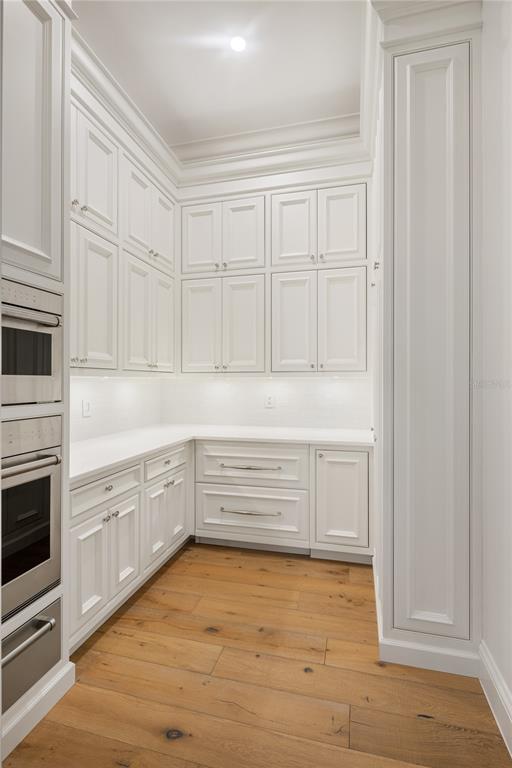 8570 Northwest 31st Lane Road Ocala, FL 34482 - Photo 27 of 53 a view white cabinets and wooden floor