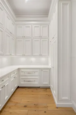 a stove top oven sitting inside of a kitchen