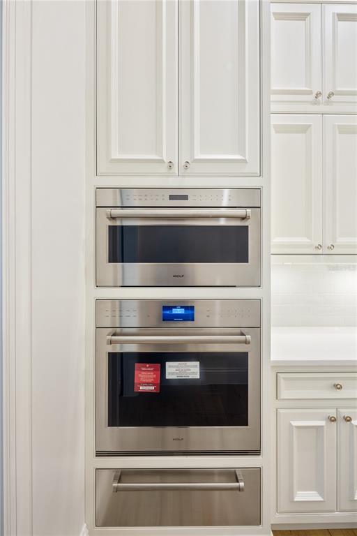 8570 Northwest 31st Lane Road Ocala, FL 34482 - Photo 29 of 53 a stove top oven sitting inside of a kitchen