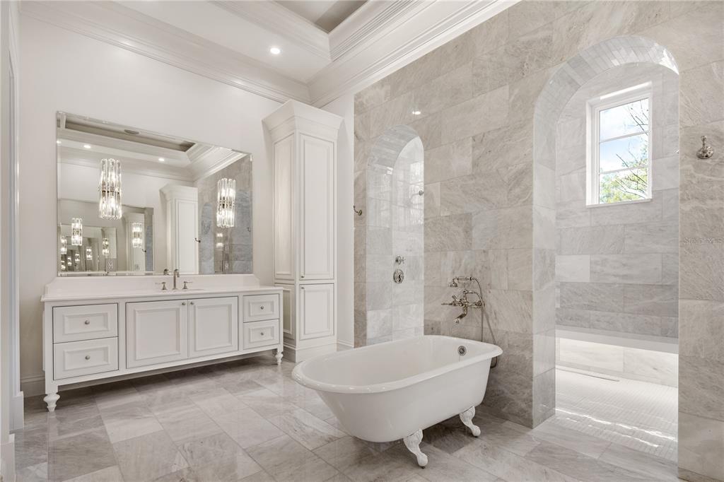 8570 Northwest 31st Lane Road Ocala, FL 34482 - Photo 37 of 53 a spacious bathroom with a double vanity sink a mirror and a bathtub