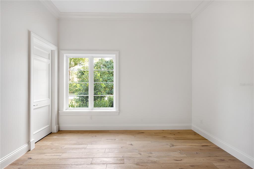 8570 Northwest 31st Lane Road Ocala, FL 34482 - Photo 43 of 53 an empty room with wooden floor and windows