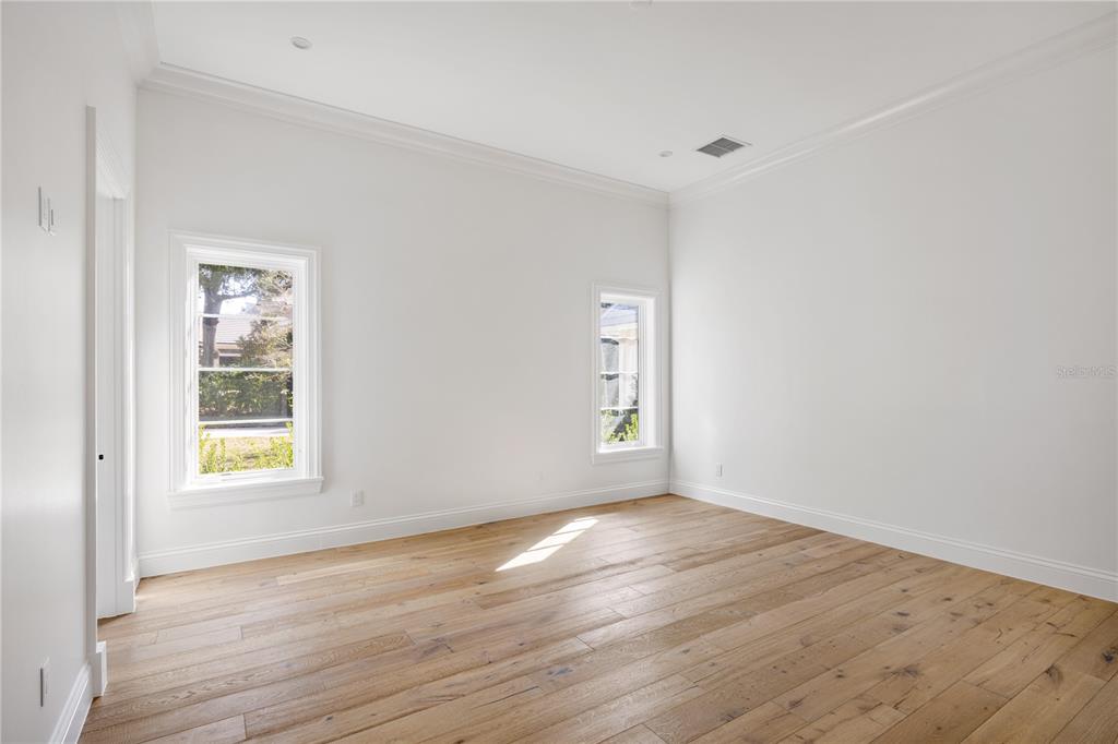 8570 Northwest 31st Lane Road Ocala, FL 34482 - Photo 44 of 53 a view of an empty room with wooden floor and a window