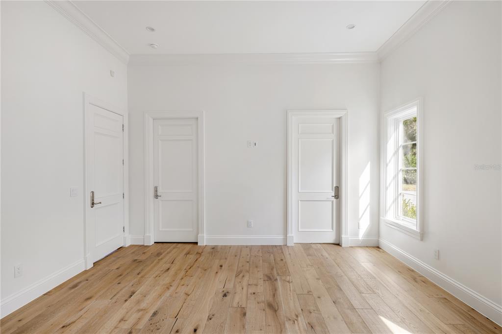 8570 Northwest 31st Lane Road Ocala, FL 34482 - Photo 45 of 53 an empty room with wooden floor and windows