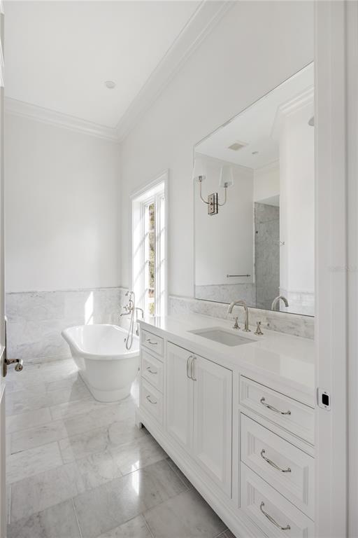 8570 Northwest 31st Lane Road Ocala, FL 34482 - Photo 47 of 53 a bathroom with a toilet a double vanity sink and a mirror