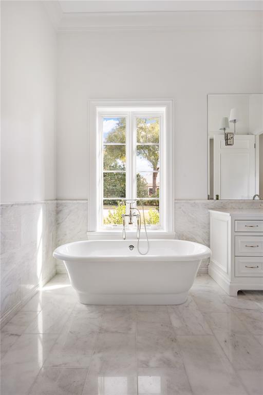 8570 Northwest 31st Lane Road Ocala, FL 34482 - Photo 48 of 53 a spacious bathroom with a bathtub and next to a window