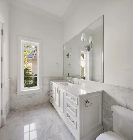 a bathroom with a shower sink vanity and mirror