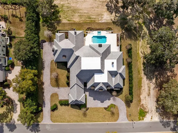 an aerial view of residential houses with outdoor space