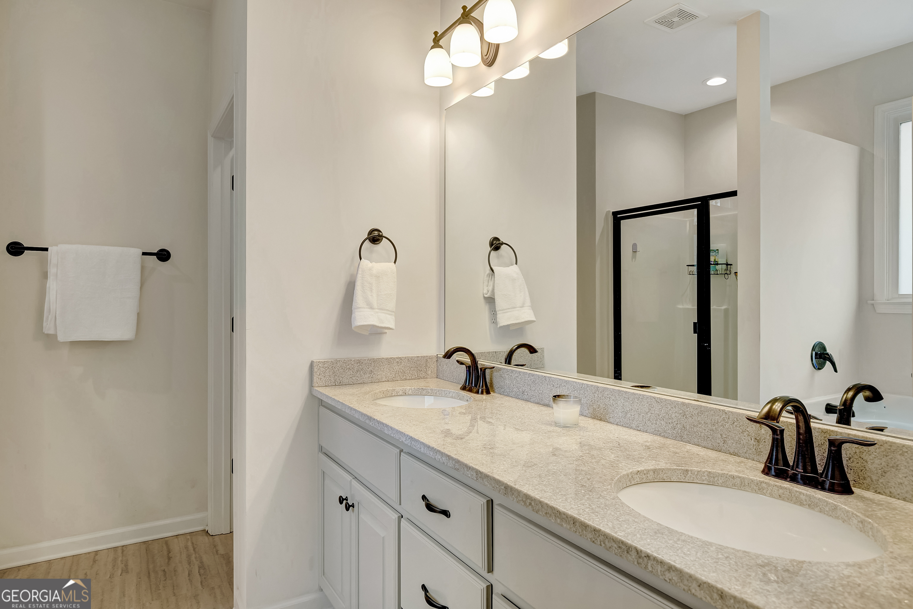 149 Raymond Carson Street Newnan, GA 30263 - Photo 25 of 42 Double vanity- with Comfort height granite countertops. Also contains water closet. Opposite shower