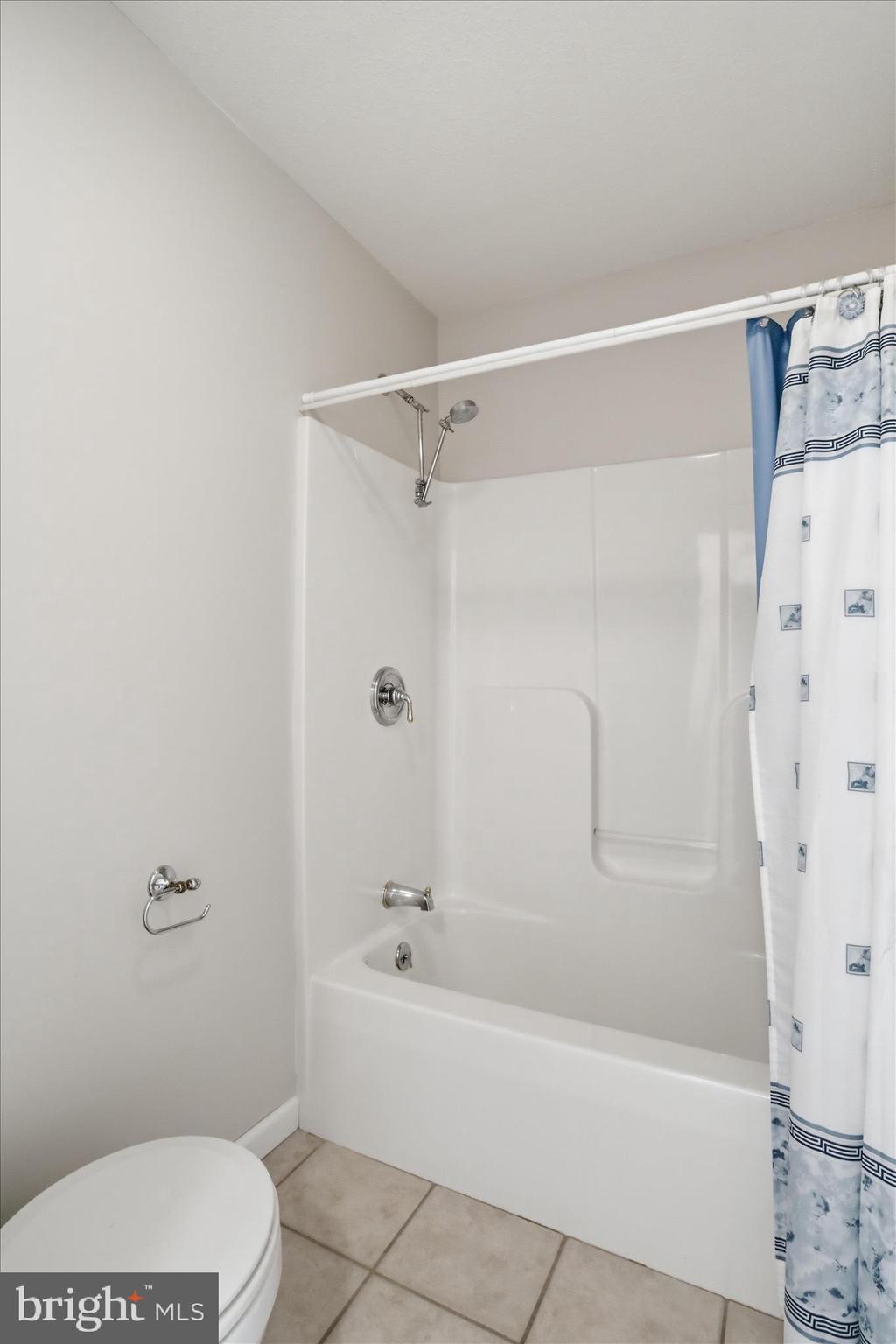 13605 McKenzie Tower Road Southwest Cumberland, MD 21502 - Photo 32 of 63 a bathroom with a toilet and shower