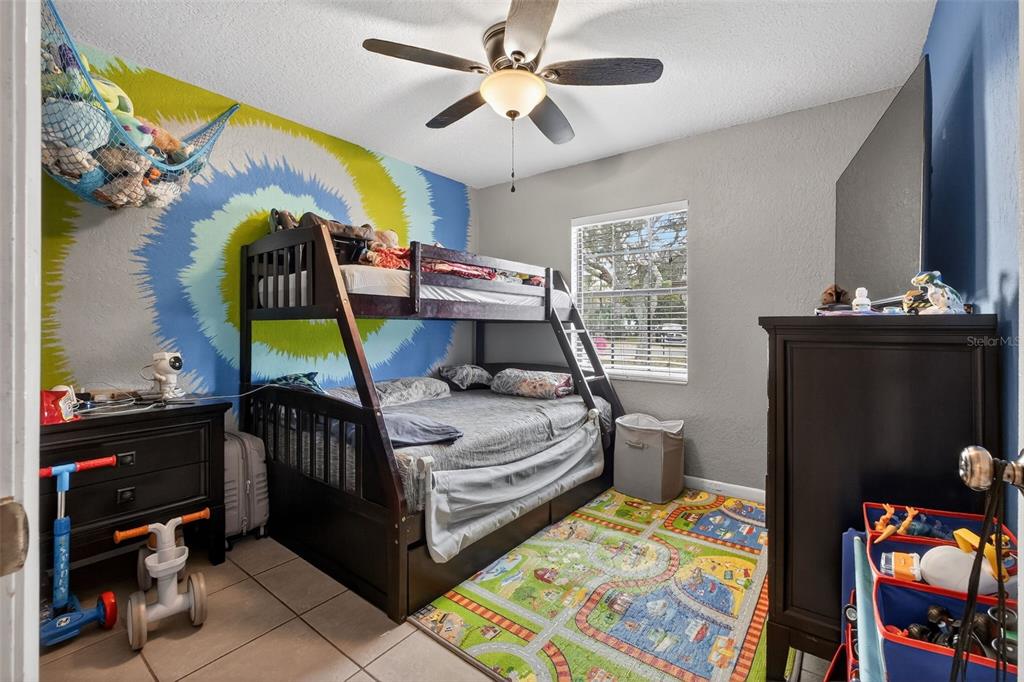 1644 Ruth Street Cocoa, FL 32926 - Photo 12 of 38 a bedroom with a bed and a mirror