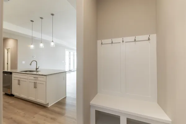 a bathroom with a sink a mirror and a shower