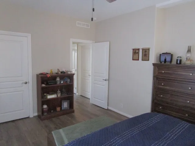 a view of room with furniture and wooden floor