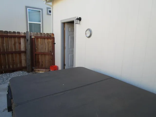 a room with a bed and a dresser