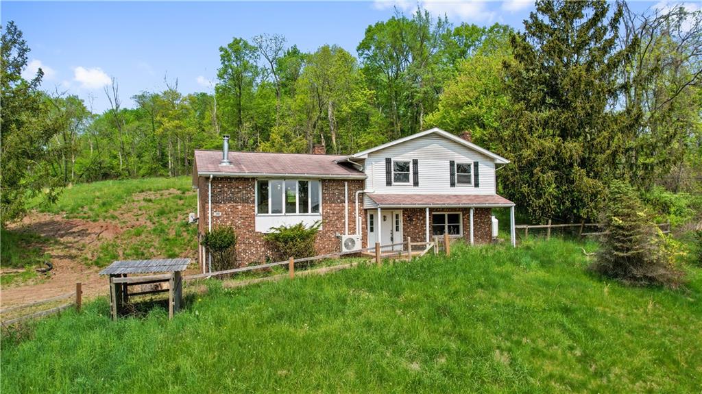 348 McCleary Road Hookstown, PA 15050 - Photo 1 of 41 a house view with a garden space