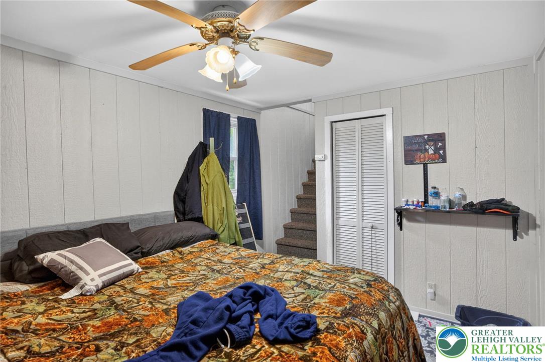 357 Main Road Lehighton, PA 18235 - Photo 33 of 38 a bedroom with a bed and a chandelier