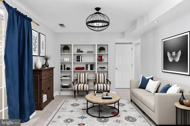 a living room with furniture and a rug