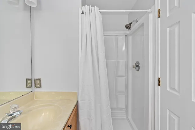 a bathroom with a tub and shower
